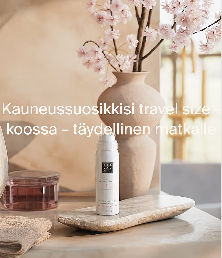 White Rituals -suihkugeelipullo marmorilla, kirsikankukkien kera. Matkakokoiset kauneussuosikit, täydelliset matkalle.