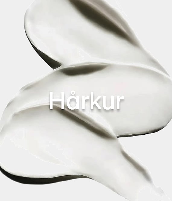Hvite kremvirvler på en lys bakgrunn med ordet "Hårmask" (hårmaske) i midten.