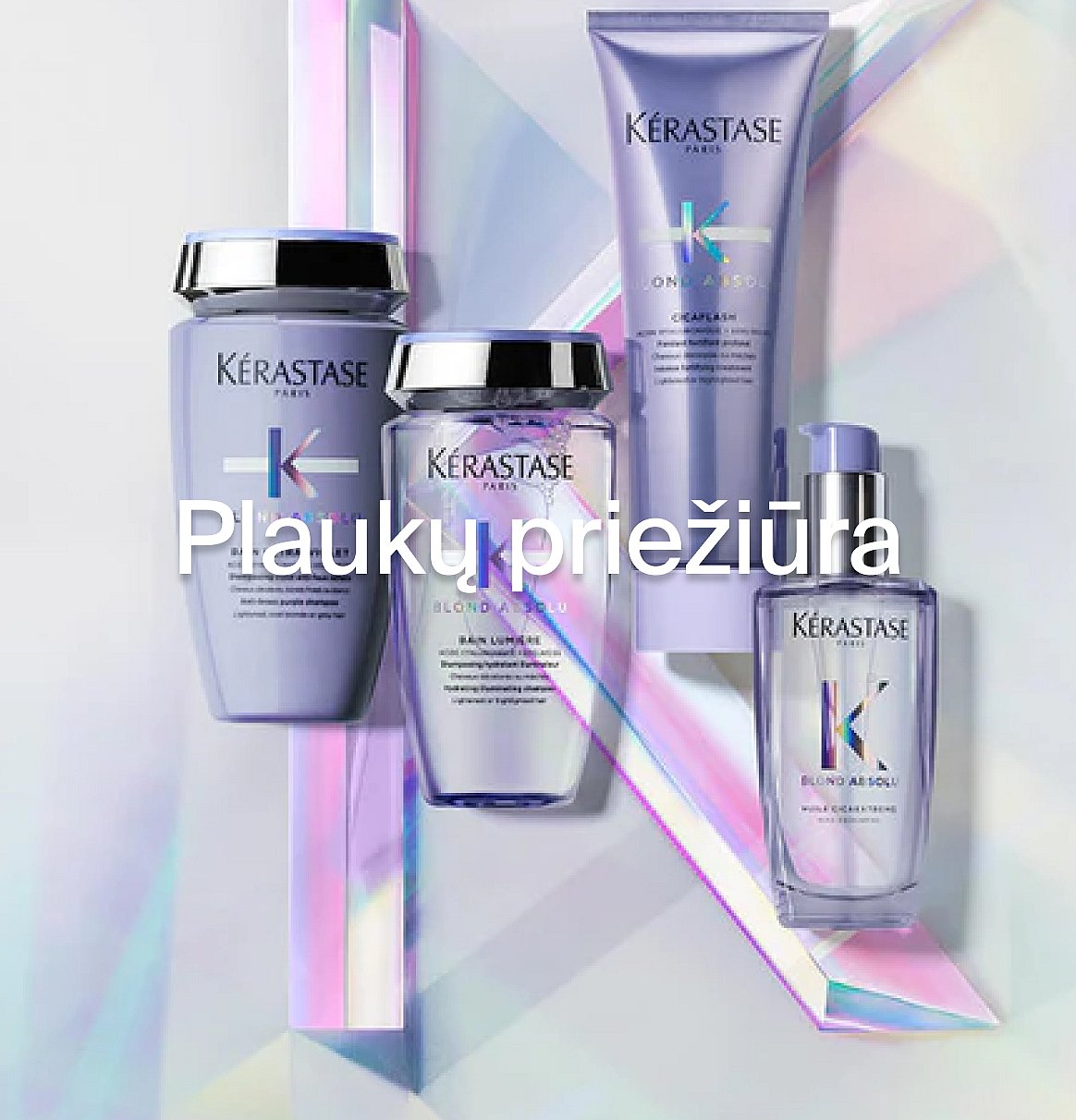 Keturi violetiniai „Kerastase“ plaukų priežiūros produktai ant vaivorykštinio fono su uždėtu tekstu „Hårvård“.