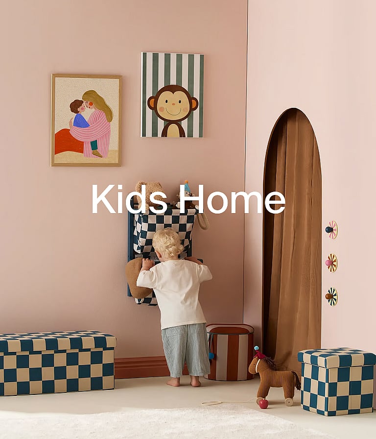 Child in a pink kids' room with playful art, checkered storage, and an arched doorway.