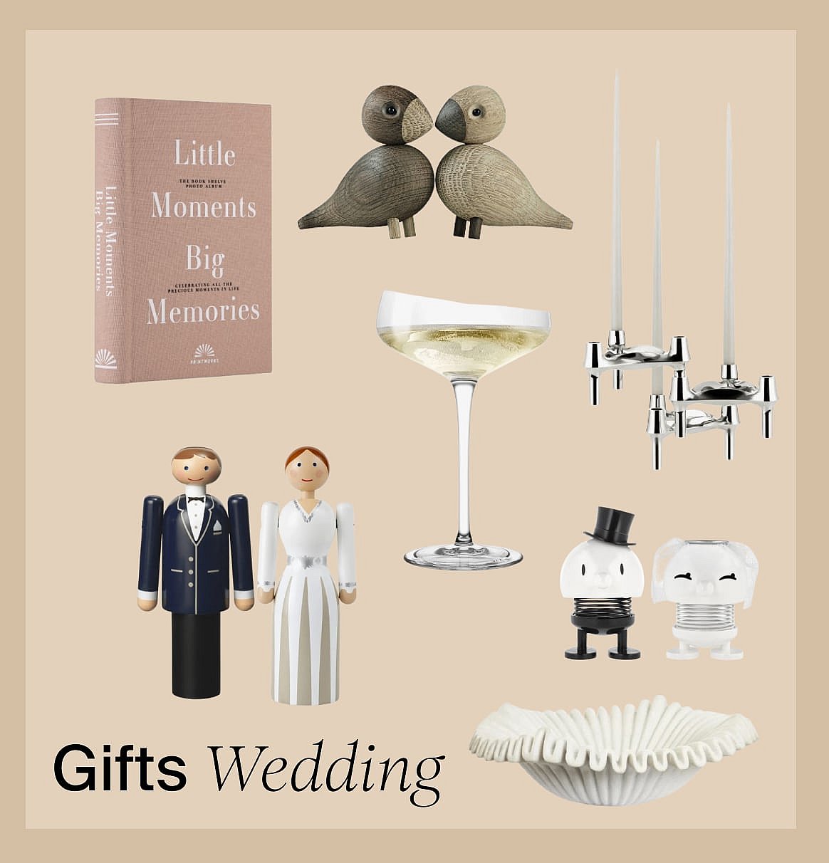 Wedding gifts: a photo album, wooden birds, champagne glass, candelabra, and various bride and groom figurines.