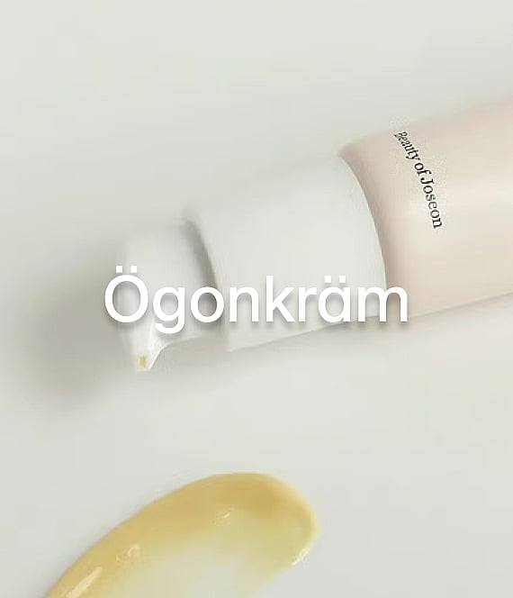 Beauty of Joseon pumpflaska pumpar ut gulaktig kräm på vitt. Stor textöverlagring "Ögonkräm".