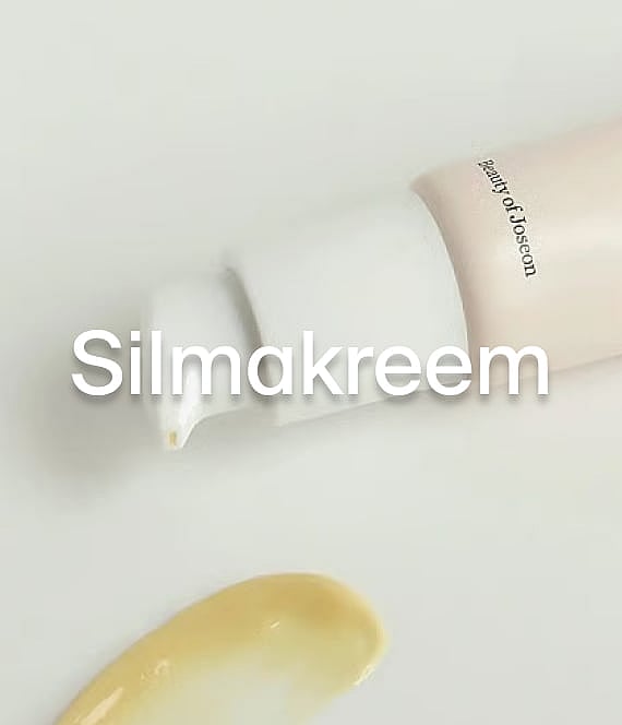 Beauty of Joseoni pumbaga pudel väljastab kollakat kreemi valgele. Suur tekstikate "Ögonkräm".