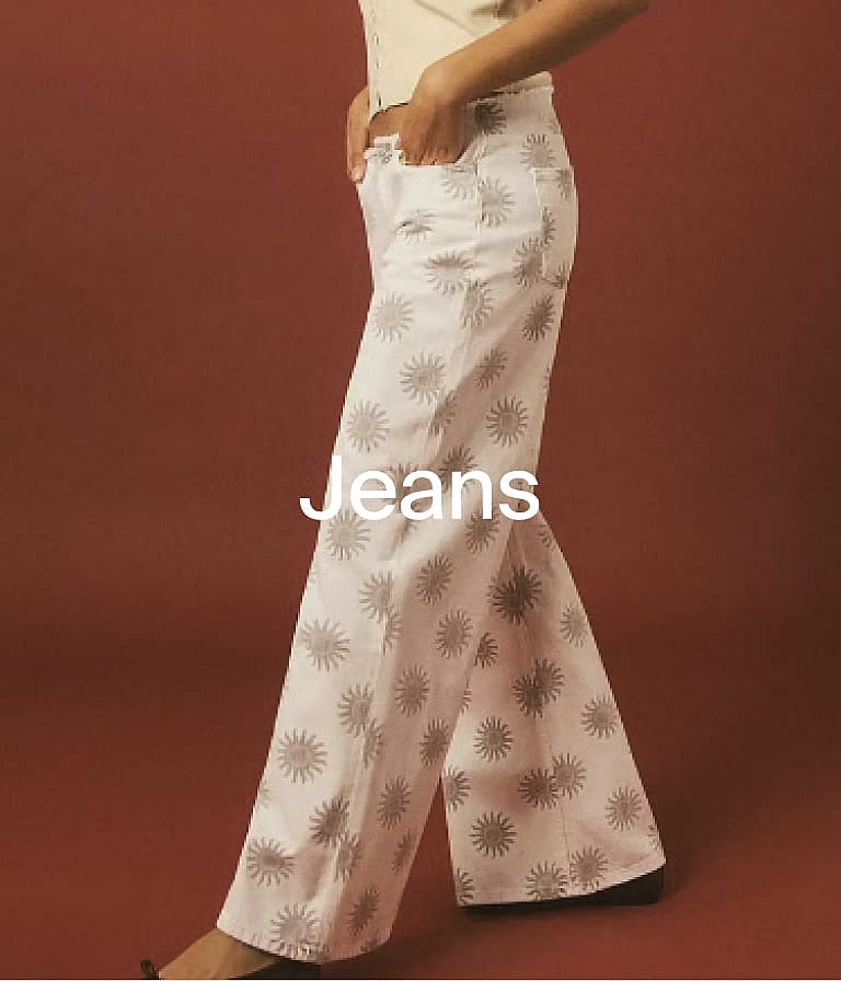 Person wearing white wide-leg jeans with gray sunburst pattern, hands in pockets, against a reddish-brown background. Text