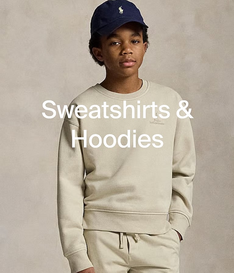 Young boy in a navy cap and beige sweatshirt and sweatpants. Text overlay: "Sweatshirts & Hoodies".