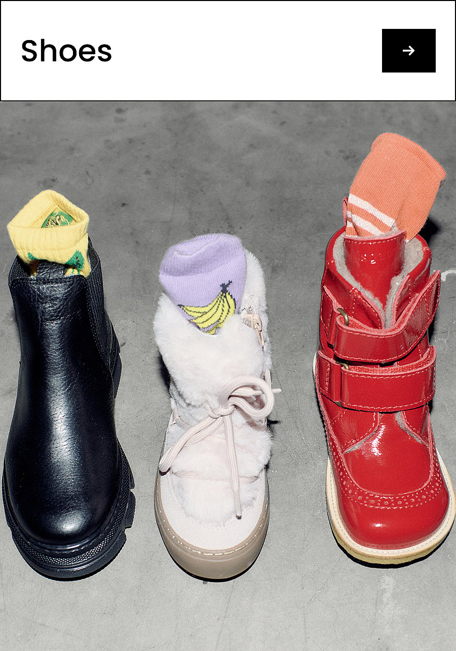 Child's feet in light gray, blue, and orange sneakers on a light gray floor. Text: Shoes