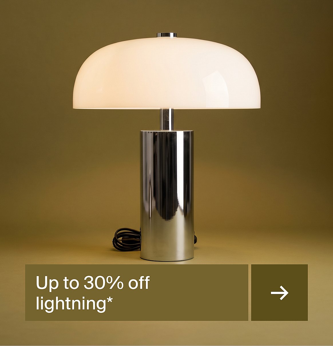 White domed lamp with a chrome cylindrical base on an olive green background.
